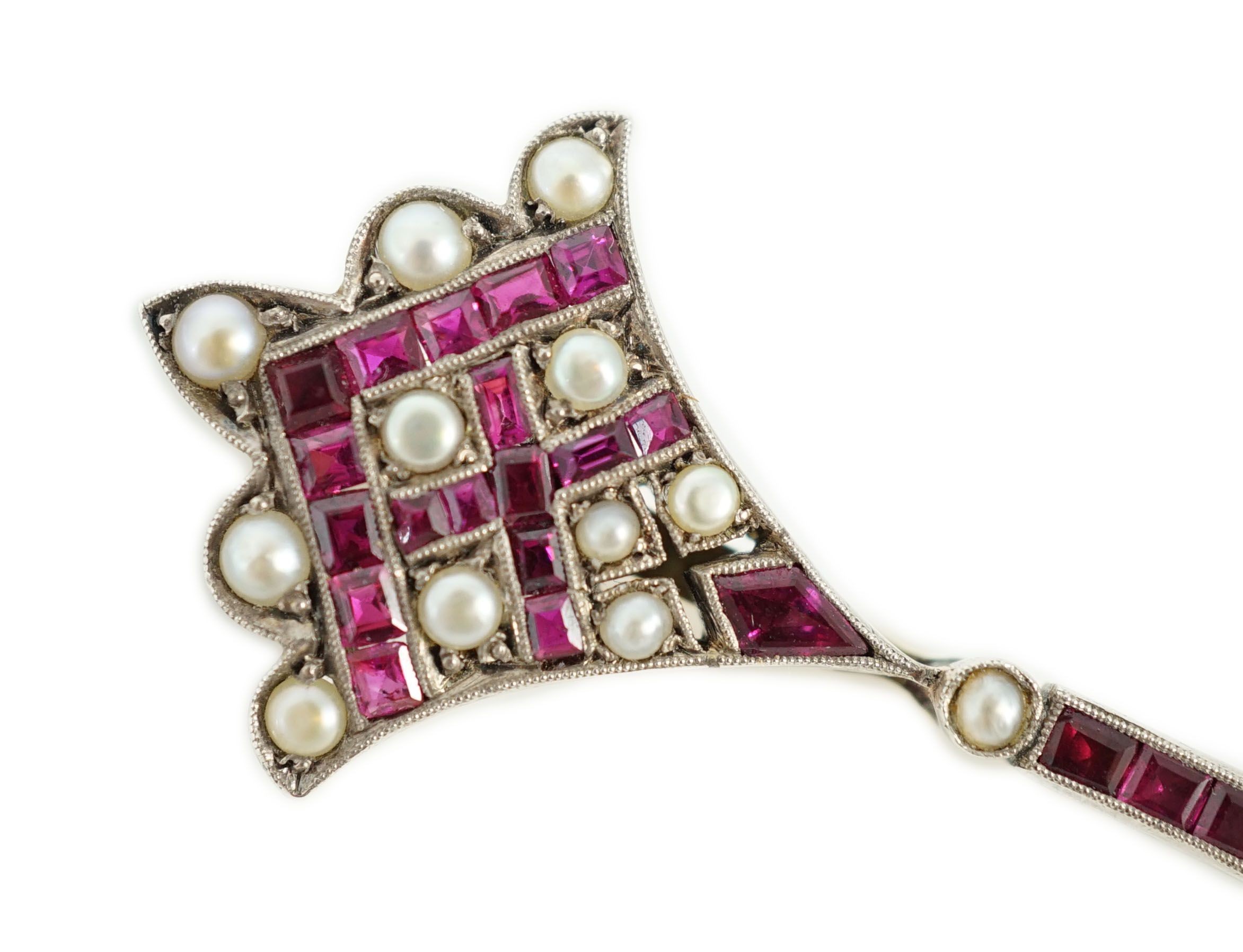 An early 20th century, gold, platinum, ruby and seed pearl set brooch